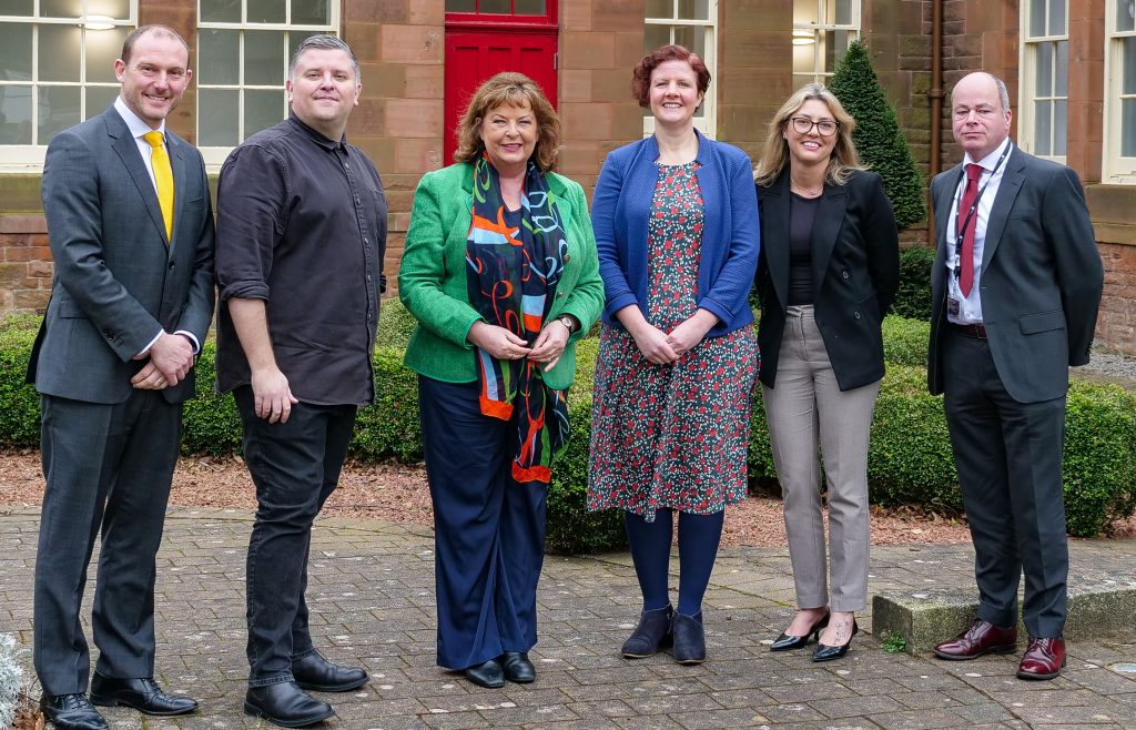 Caption: Left to right: Simon Bradbury, Lead Officer of SWestrans; Alan Webb, Chief Executive Officer, Third Sector Dumfries and Galloway; Fiona Hyslop, Cabinet Secretary for Transport; Helen Keron, Executive Manager of Glenkens Community and Arts Trust and Galloway Community Transport; Juliana Amaral, Chief Executive Officer, Borders Community Action; and Grant Coltart, Team Leader of Transport Planning and Operations at Dumfries and Galloway Council.